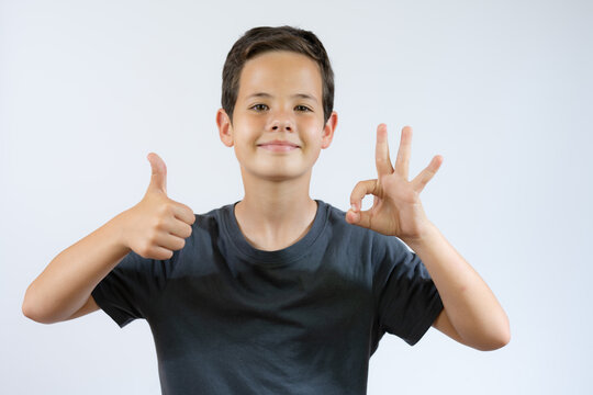 Zen, Meditation, Consciousness, Balance And Peace Concept. Portrait Of Cute Handsome Self Conscious Caucasian Little Boy Peacefully Holding His Fingers , Meditating