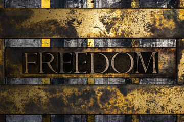 Freedom text on vintage textured grunge copper and gold steampunk background