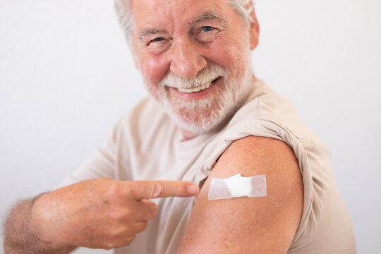 Beautiful smiling senior man 70s after receiving the coronavirus covid-19 vaccine.