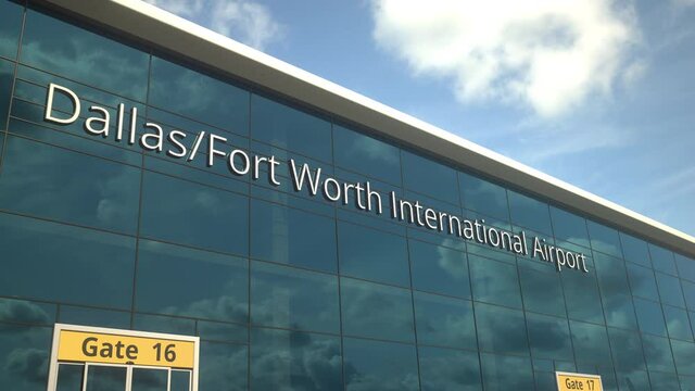 Airliner landing reflecting in the windows with Dallas Fort Worth International Airport text