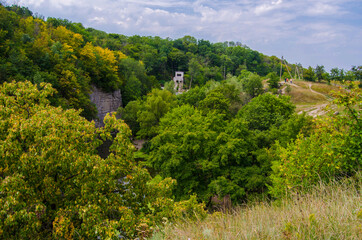 Beautiful river in a rocky canyon among the green nature, an old abandoned building, Buky Canyon Ukraine, the Hirskyi Tikych river