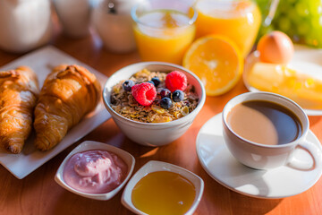 Breakfast served with coffee, orange juice, croissants, cereals