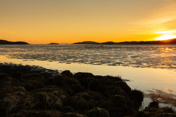 Golden winter sunset over Kirkcudbright Bay mudflats and the Dee estuary