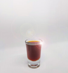 Close up of a jager shot glass on white background