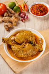 Indonesian Traditional cuisine : Ayam Gulai Padang with indonesian spicies. Ayam Gulai is a popular dish of chicken curry from Padang, West Sumatra 