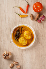 Top of View Gulai telur or eggs serve with curry sauce, Gulai Telur is traditional food of Indonesia from Padang, West Sumatera.
