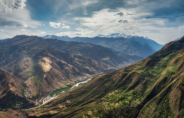 Amazing spring landscape with silhouettes of big rocky mountains