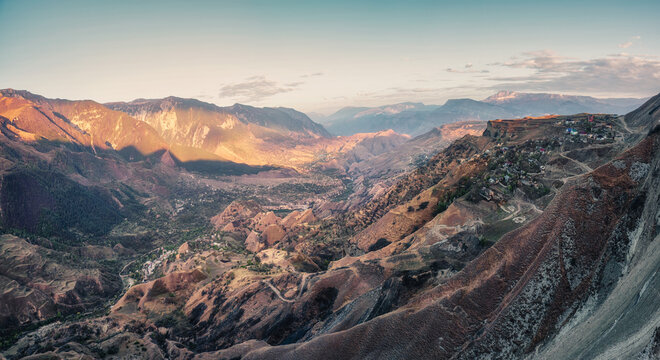 Mountain Valley With Red Mountains. Morning Panoramic View Of A Mountain Valley With A Serpentine Road. Matlas Gorge.