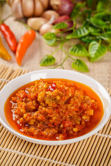 Close up View Sambal Bawang Or Spicy Onion Sauce with ingredients, Onion, Red Chilies, garlic, and salt. Sambal Bawang is favorite chili sauce in Indonesia