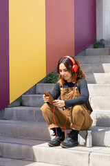 Fototapeta premium Women headphones street phone