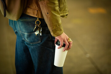 close up of a man holding a coffee in New York City