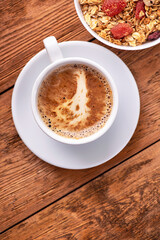 Coffee cup with granola with dried fruit