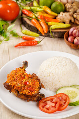 Ayam Geprek or Ayam sambal bawang and Rice

Ayam Geprek or Ayam Sambal Bawang and Rice is Popular fried chicken dish from Medan, deep-fried whole chicken and topped with sambal bawang