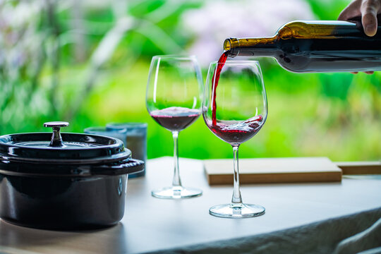 Two glasses of red wine on a table.Modern lifestyle image.