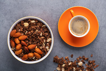 Orange coffee cup with almond granola