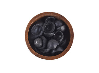 macadamia charcoal in wooden  isolated on white background
