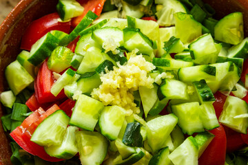 Closeup on malibu salad dressed with mayonnaise on the wooden table