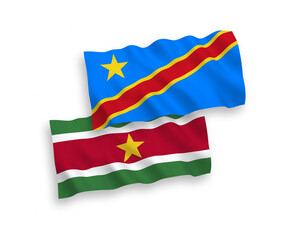 National vector fabric wave flags of Republic of Suriname and Democratic Republic of the Congo isolated on white background. 1 to 2 proportion.
