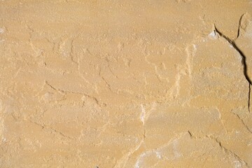 Sandstone tile texture with rough uneven surface