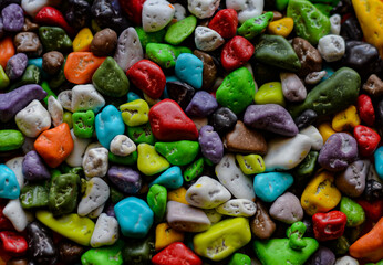 Fototapeta na wymiar Colored stones - chocolate stones in a colored glaze