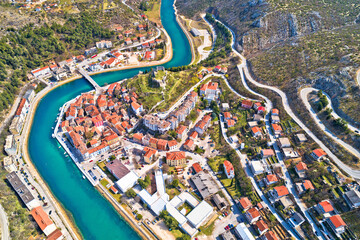 Town of Obrovac and Zrmanja river canyon panoramic aerial view