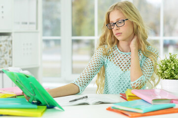 Cute   schoolgirl doing homework