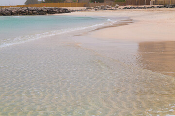 Fototapeta na wymiar Beach. Blue sea and white sand. Summer time. Seacost
