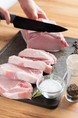 Woman preparing raw meat