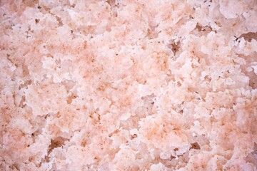 Pink salt lake texture close up
