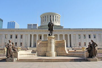 A statue of William McKinley stands in front of the Ohio Statehouse in Columbus Ohio.