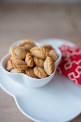mini savoury fish filled puff pastry snack food, nuts, healthy, snack, nut, brown, walnut, isolated, bowl, closeup, white, diet, walnuts, natural, fruit, ingredient, organic, cashew, peanut, heap, see