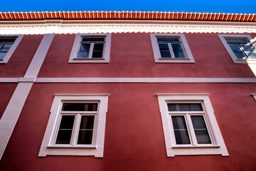 Old colorful typical facade next to the water canal in Aveiro village in Porto