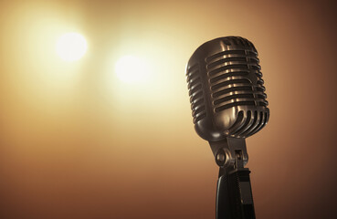 Close up of a retro microphone at the stage with copy space