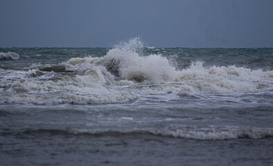 waves breaking on the anyer beach, in Indonesian