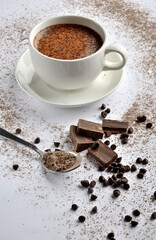 cup of coffee with chocolate on a table