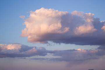 A large cloud against a blue sky.