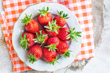 Strawberry fresh juicy fruits berries ripe harvest sweet dessert summer organic on the table healthy meal copy space food background rustic top view keto or paleo diet veggie vegan or vegetarian food