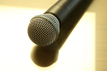 Obraz premium Handheld microphone on the table. Seminar Conference Concept