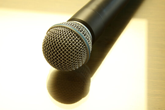 Handheld microphone on the table. Seminar Conference Concept