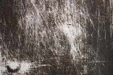 The texture of old metal covered with scratches