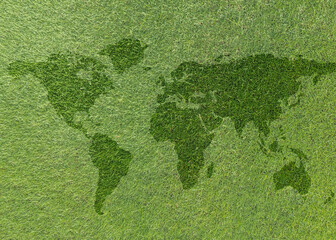 World map on green grass lawn background for global eco-friendly environment, ecological and...