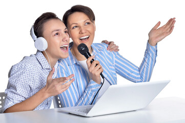 Mother and son singing karaoke  together