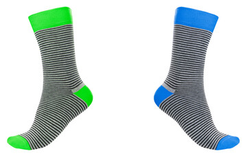 Two volumetric socks with different lines isolated on white background. Colorful volumetric socks on white background. Colored socks on the leg isolated on white background