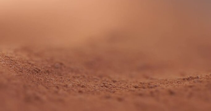 Powder flowing as sand like object closeup