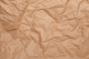background of crumpled brown paper close-up, place for your text