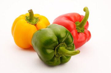 Several Colorful Green, Yellow, Red, Shimla Chilli Or Peppers, isolated on white background.