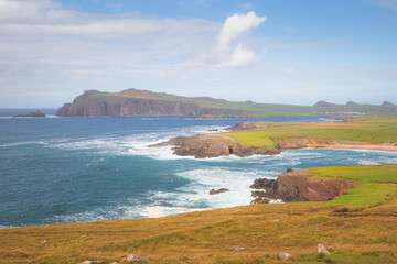 Scenic coastal seascape and landscape view from Ceann Sreatha on Waymont headland of Clogher Strand bay beach on the Dingle Peninsula, Ireland.