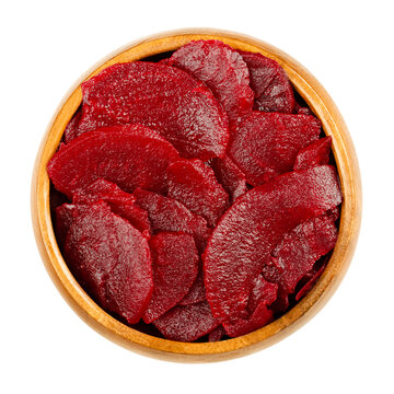 Sliced Pickled Beetroot Slices, In A Wooden Bowl. Cooked, Cut And Preserved Deep Red Beets, Used As Salad Or Added To A Meal. Close-up, From Above, Isolated On White Background, Macro Food Photo.