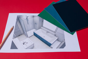Blick auf den Entwurf einer Badezimmerplanung mit Badewanne und Dusche. Auf der Planung liegen...