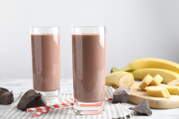 Fresh yummy chocolate milk on white table